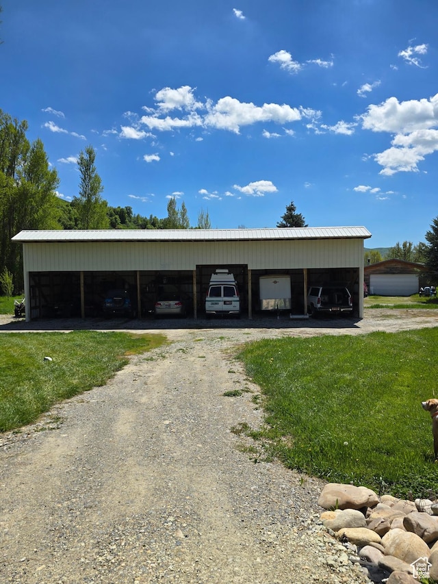 5654 E Cub Rd, Preston, ID 83263 - view of outdoor structure featuring driveway and a carport