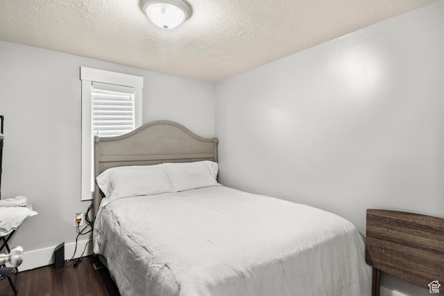 3654 Ogden Ave, Ogden, UT 84403 - bedroom with wood finished floors, a textured ceiling, and baseboards