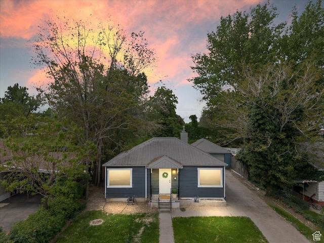 1042 E 460 S, Provo, UT 84606 - view of front of home with a chimney, a front lawn, and metal roof