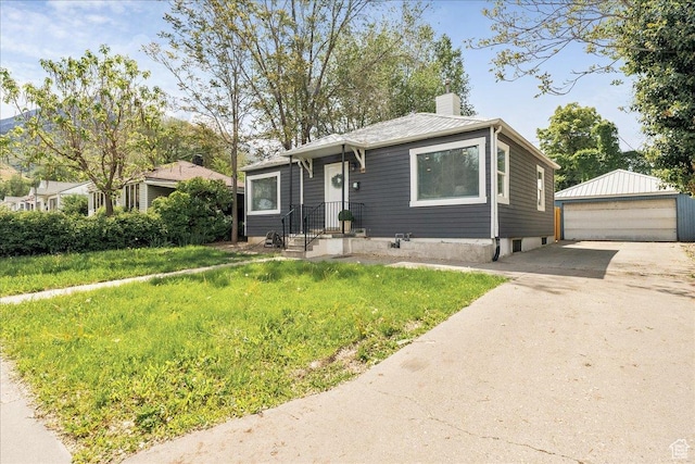 1042 E 460 S, Provo, UT 84606 - view of front of house with a chimney, a garage, an outdoor structure, and a front lawn