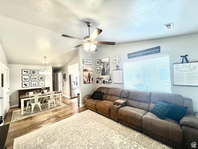 2497 W 500 S Unit 3, Springville, UT 84663 - living room with lofted ceiling, wood finished floors, a ceiling fan, baseboards, and a textured ceiling