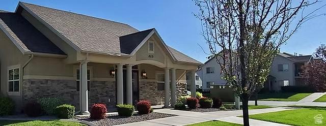 2497 W 500 S Unit 3, Springville, UT 84663 - rear view of house with a porch, stone siding, and a lawn