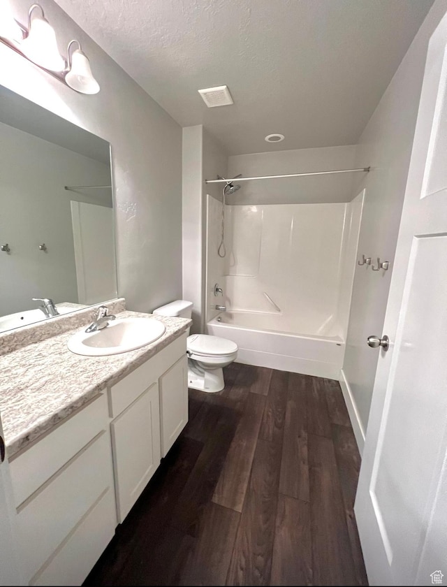 2497 W 500 S Unit 3, Springville, UT 84663 - bathroom with tub / shower combination, toilet, wood finished floors, vanity, and a textured ceiling