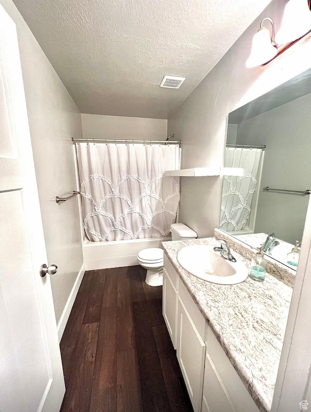 2497 W 500 S Unit 3, Springville, UT 84663 - bathroom featuring hardwood / wood-style flooring, a textured ceiling, toilet, vanity, and baseboards