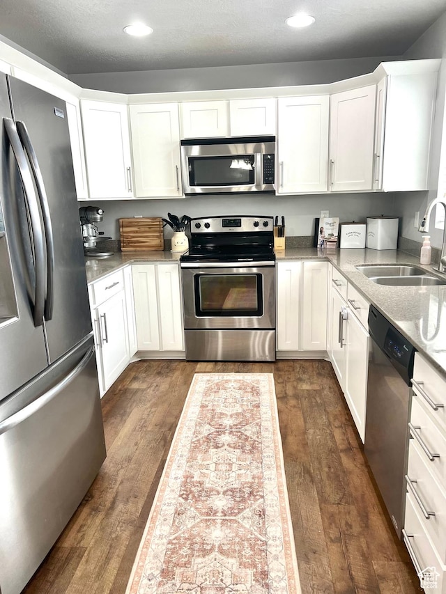 2497 W 500 S Unit 3, Springville, UT 84663 - kitchen featuring stainless steel appliances, a sink, dark wood finished floors, recessed lighting, and white cabinetry