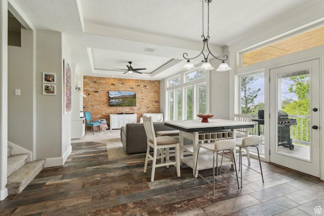 1001 E 1500 N, Layton, UT 84040 - dining area featuring a tray ceiling, ceiling fan, and baseboards