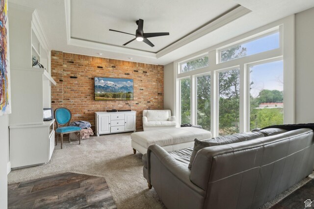 1001 E 1500 N, Layton, UT 84040 - living room with a ceiling fan, a raised ceiling, carpet, and ornamental molding