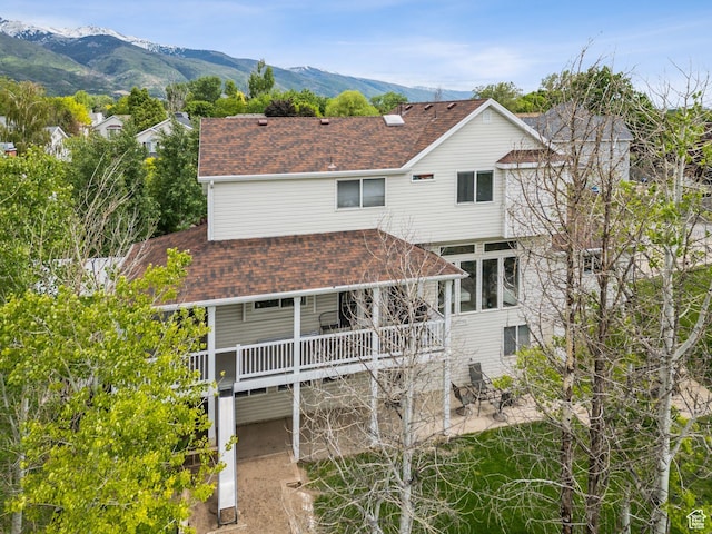 1001 E 1500 N, Layton, UT 84040 - view of front facade featuring a patio area, roof with shingles, and a mountain view