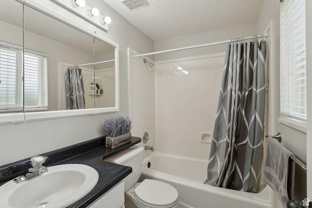 1001 E 1500 N, Layton, UT 84040 - bathroom featuring shower / tub combo with curtain, vanity, and toilet