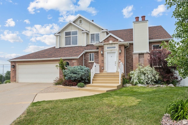 1001 E 1500 N, Layton, UT 84040 - view of front of house featuring concrete driveway, roof with shingles, a front yard, brick siding, and a chimney