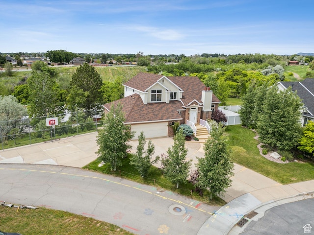 1001 E 1500 N, Layton, UT 84040 - view of front of property with driveway, a garage, fence, and a shingled roof