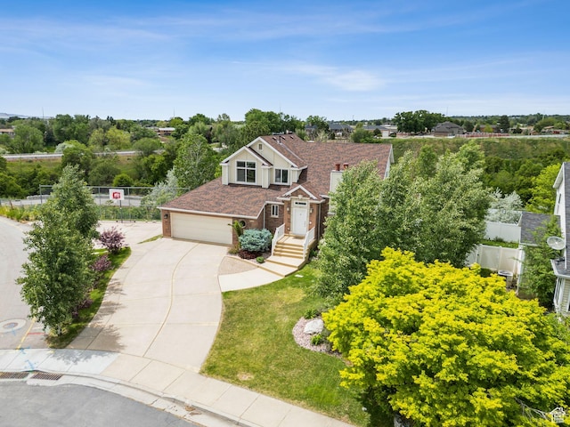 1001 E 1500 N, Layton, UT 84040 - view of front of property featuring concrete driveway, brick siding, and an attached garage