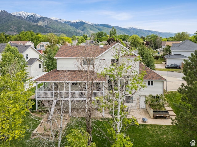 1001 E 1500 N, Layton, UT 84040 - rear view of house featuring a residential view, roof with shingles, a mountain view, and a patio