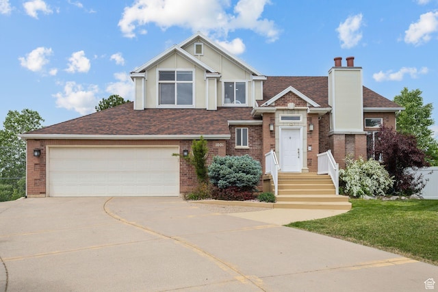 1001 E 1500 N, Layton, UT 84040 - view of front of property with concrete driveway, brick siding, and a shingled roof