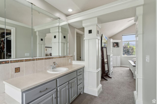 1001 E 1500 N, Layton, UT 84040 - bathroom with decorative backsplash, vanity, recessed lighting, vaulted ceiling, and a walk in closet