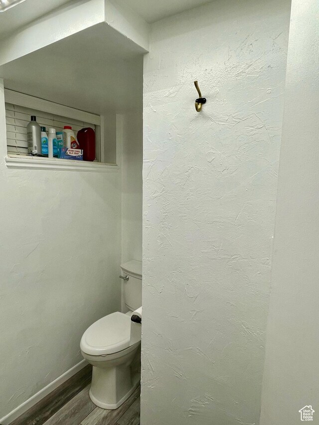 229 N 300 W, Salina, UT 84654 - bathroom featuring wood finished floors, toilet, and baseboards