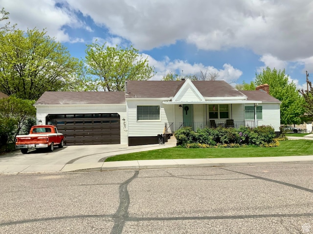 229 N 300 W, Salina, UT 84654 - view of front of house featuring an attached garage, driveway, a porch, and a front yard