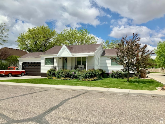 229 N 300 W, Salina, UT 84654 - view of front of property featuring a garage, a porch, a front lawn, driveway, and roof with shingles