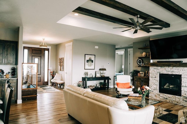 2366 W 3750 N, Cedar City, UT 84721 - living room with wood finished floors, a ceiling fan, a fireplace, beamed ceiling, and recessed lighting