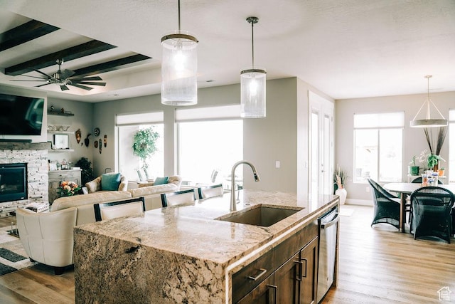2366 W 3750 N, Cedar City, UT 84721 - kitchen featuring a sink, light wood-style flooring, dishwasher, open floor plan, and beam ceiling