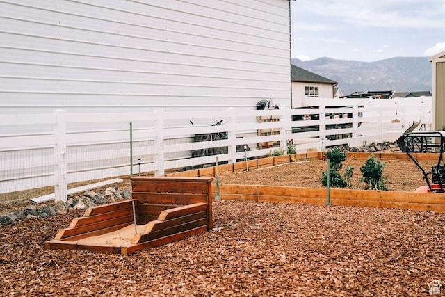 2366 W 3750 N, Cedar City, UT 84721 - view of home's exterior featuring a vegetable garden, a mountain view, and fence