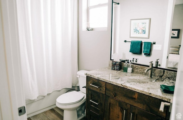 2366 W 3750 N, Cedar City, UT 84721 - bathroom featuring toilet, wood finished floors, vanity, and shower / tub combo