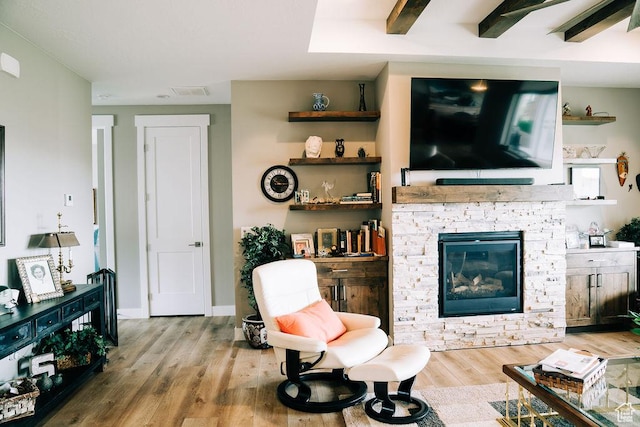 2366 W 3750 N, Cedar City, UT 84721 - living area featuring wood finished floors, a stone fireplace, and baseboards