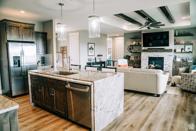 2366 W 3750 N, Cedar City, UT 84721 - kitchen with stainless steel appliances, ceiling fan, a sink, light stone counters, and pendant lighting