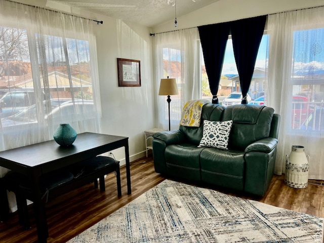 1150 W Red Hills Pkwy Unit 140, Washington, UT 84780 - living room with wood finished floors, baseboards, and vaulted ceiling