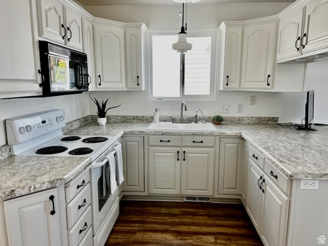 1150 W Red Hills Pkwy Unit 140, Washington, UT 84780 - kitchen with white range with electric cooktop, black microwave, a sink, and white cabinets