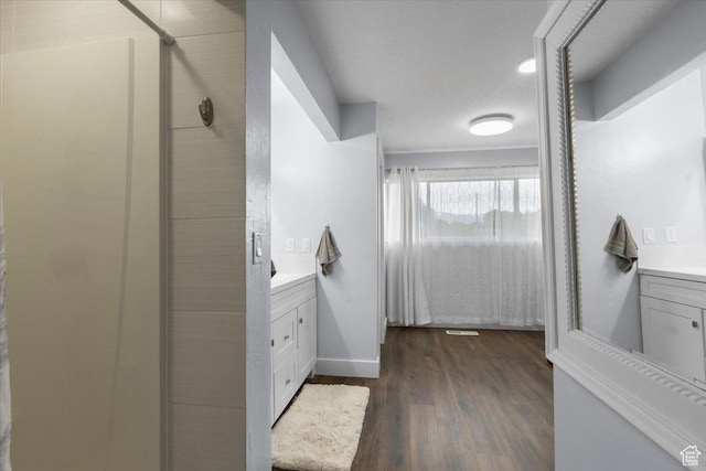 131 N 100 W, Hyrum, UT 84319 - bathroom with ensuite bath, vanity, wood finished floors, a shower stall, and baseboards