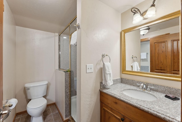 840 Bigler Ln Unit 3031, Midway, UT 84049 - full bath featuring a shower stall, toilet, tile patterned flooring, vanity, and baseboards