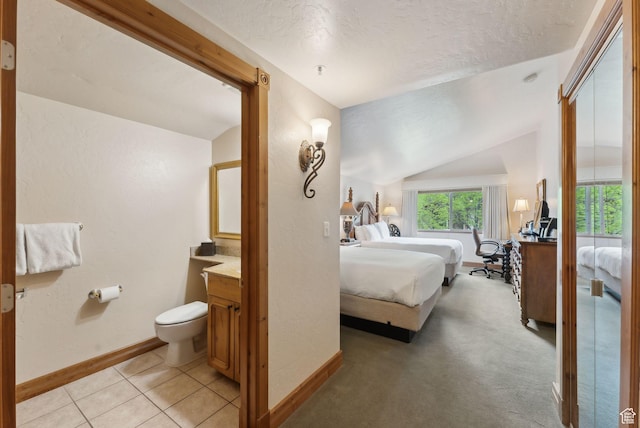 840 Bigler Ln Unit 3031, Midway, UT 84049 - bedroom with a textured ceiling, lofted ceiling, baseboards, and light tile patterned flooring