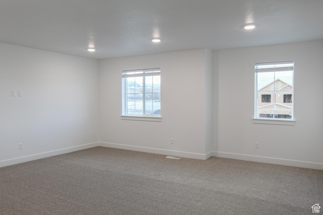 743 E 1250 S, Hyrum, UT 84319 - empty room featuring plenty of natural light, carpet flooring, and recessed lighting