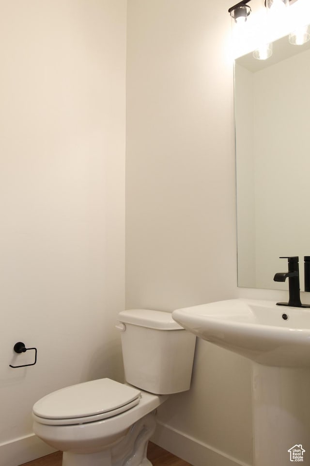 743 E 1250 S, Hyrum, UT 84319 - bathroom with baseboards and wood finished floors