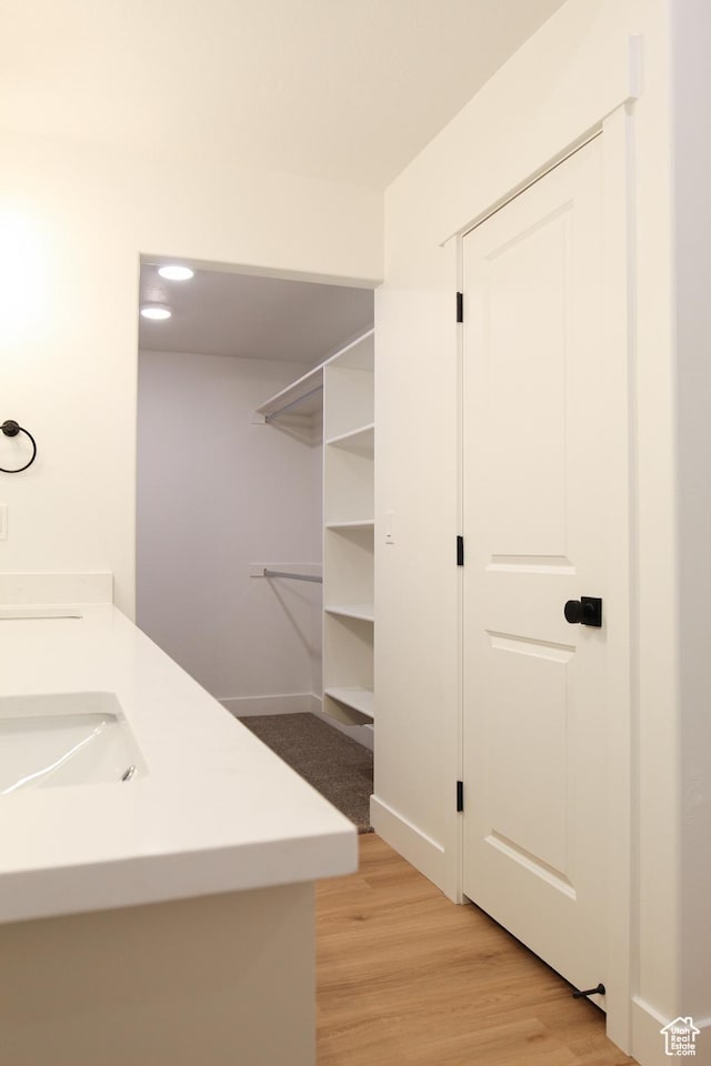 743 E 1250 S, Hyrum, UT 84319 - laundry area with light wood-style flooring and a sink