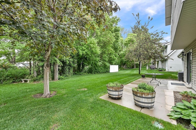 1076 E Creekside, Ogden, UT 84404 - view of grassy yard with a patio area