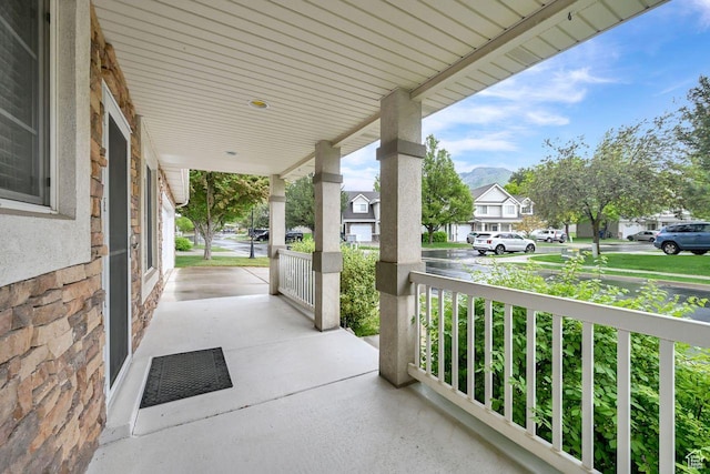 1076 E Creekside, Ogden, UT 84404 - view of patio with a porch and a residential view