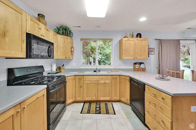 1076 E Creekside, Ogden, UT 84404 - kitchen with black appliances, light brown cabinets, a sink, a peninsula, and a textured ceiling