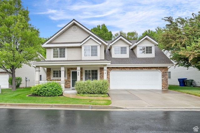 1076 E Creekside, Ogden, UT 84404 - view of front of house featuring driveway, covered porch, stone siding, and a shingled roof