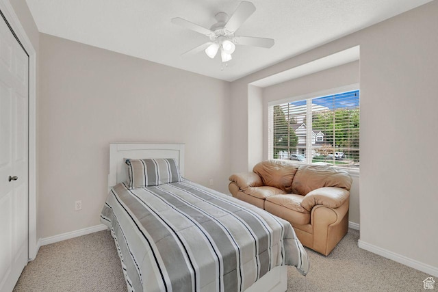 1076 E Creekside, Ogden, UT 84404 - bedroom featuring light carpet, baseboards, a ceiling fan, and a closet