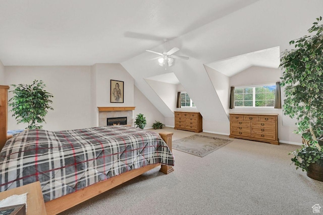 1076 E Creekside, Ogden, UT 84404 - bedroom with vaulted ceiling, carpet flooring, baseboards, a tiled fireplace, and a ceiling fan