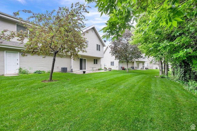 1076 E Creekside, Ogden, UT 84404 - view of grassy yard with cooling unit