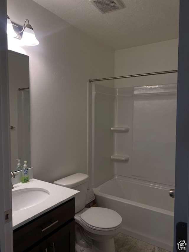 5841 W Lake Ave, South Jordan, UT 84009 - bathroom featuring vanity, toilet, and tub / shower combination