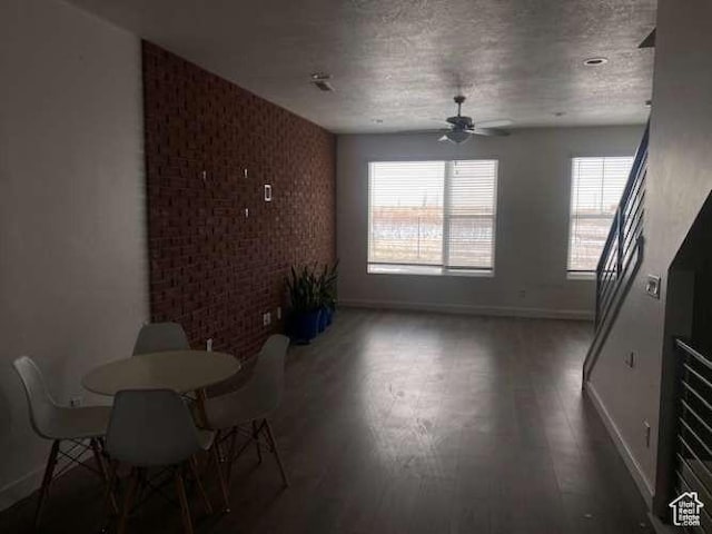 5841 W Lake Ave, South Jordan, UT 84009 - unfurnished dining area with baseboards, a ceiling fan, wood finished floors, and a textured ceiling