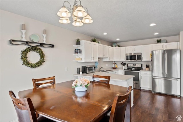 1298 S 1410 E, Provo, UT 84606 - dining area featuring a chandelier, a textured ceiling, recessed lighting, and dark wood-style floors