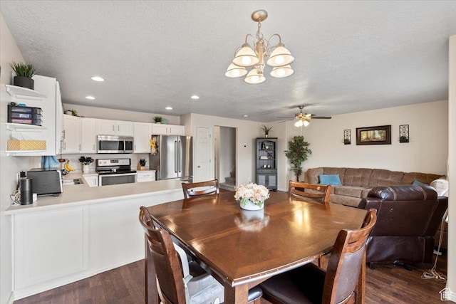 1298 S 1410 E, Provo, UT 84606 - dining area with dark wood-style flooring, a chandelier, a ceiling fan, a textured ceiling, and recessed lighting