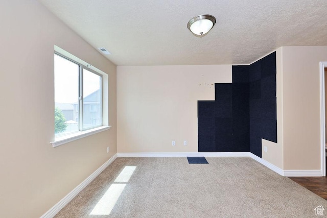 1852 E Whitetail Dr N Unit 106, Layton, UT 84040 - spare room with carpet flooring, baseboards, and a textured ceiling