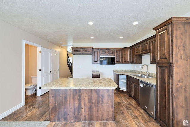 1852 E Whitetail Dr N Unit 106, Layton, UT 84040 - kitchen featuring dishwasher, a sink, dark brown cabinets, a textured ceiling, and a center island