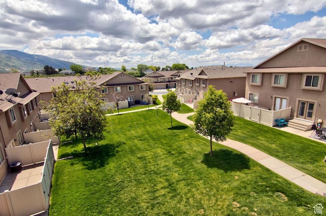 1852 E Whitetail Dr N Unit 106, Layton, UT 84040 - view of yard with a residential view and a mountain view